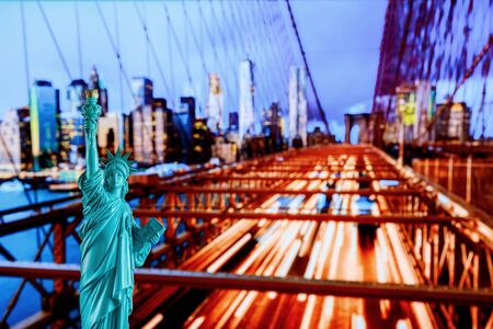Manhattan Skyline, Brooklyn Bridge and The Statue of Liberty at New York City