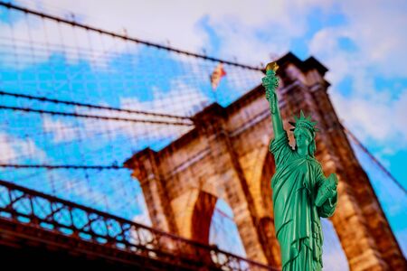New York City skyline with the statue of liberty and Brooklyn Bridgeの写真素材