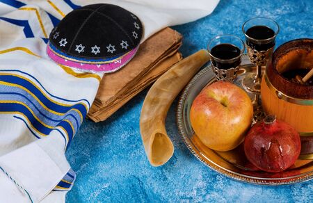 Rosh Hashanah holiday composition with honey, apple and pomegranateの写真素材