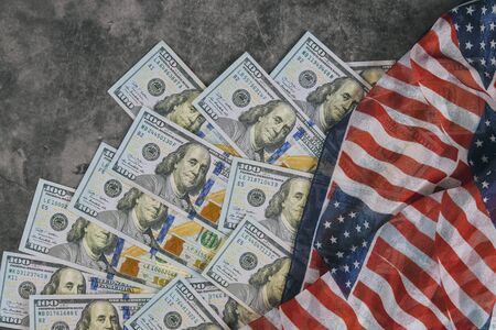 American flag and banknotes 100 USA dollar bill in the USA financial sector