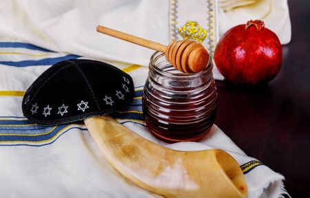 Honey and apples on shofar horn jewish holiday Rosh Hashanah torah book, kippah a yamolka talitの写真素材