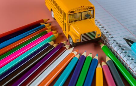 Back to school concept with bus and notebook ,colored pencilsの写真素材