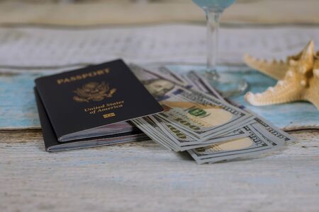 US passport with cash money, ticket and starfish, travel concept.