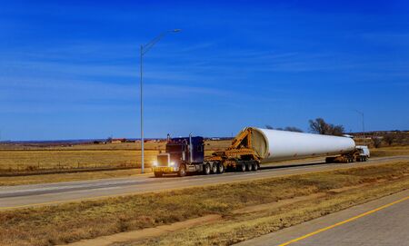 Transporting wing the farm wind turbines blade on trailerの写真素材