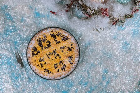 Christmas snowflake pie on frosty snow. New Year and Christmas concept.の写真素材