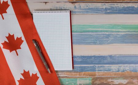 Holiday Happy Victoria Day Canadian flags notepad with pen of Canada independence day rustic backgroundの写真素材
