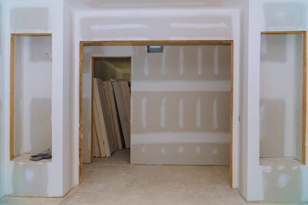Interior construction of housing project with door and molding installed construction materialsの写真素材
