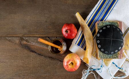 Jewish Holiday Rosh hashanah honey and apples with pomegranate traditional symbolsの写真素材