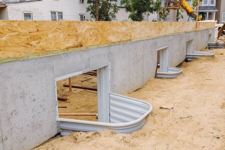 Installation of the wooden frame house construction flooring base under construction