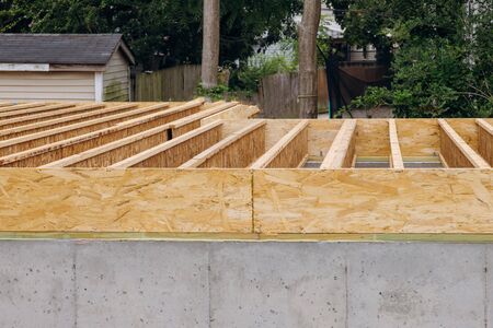 Installation if the construction frame house showing joists trusses