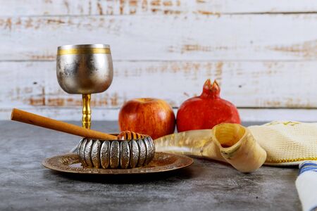 Jewish new year symbol Rosh hashanah with glass honey jar and fresh ripe apples.の写真素材