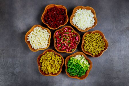 Salads from fresh and cooked vegetables, onion, potato, sweet peas, beetroot and pickles.