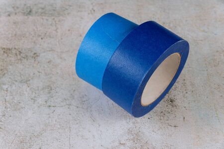 Blue painter tape for multi surfaces on white wall backgroundの写真素材