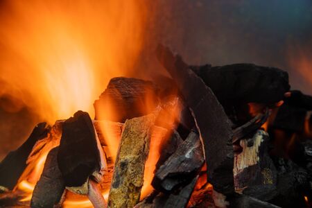 Sparks coming out of red-hot coal a barbecue