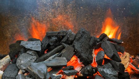 Hot coals in the glowing charcoal for preparing grilling bbqの写真素材