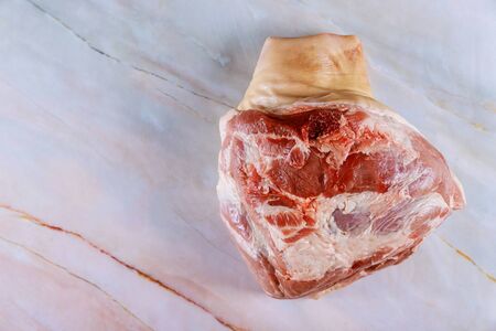 Raw pork meat leg in marble backgroundの写真素材