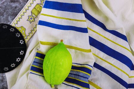 Traditional symbols Jewish festival of Sukkot Etrog, lulav, hadas, arava praying book kippah Tallit...