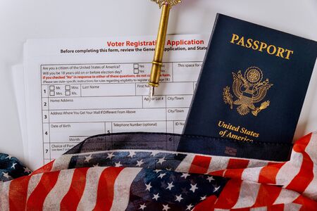American vote with USA of American citizenship registration passport covered by American Flagの写真素材