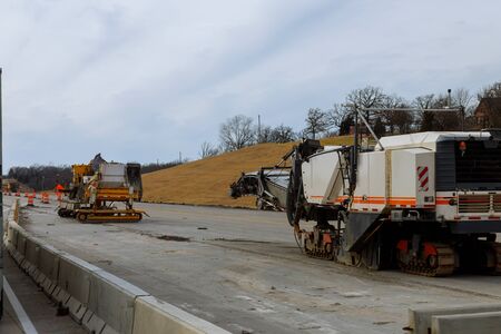 Road construction equipment are working on a new road construction repair route extensionの写真素材