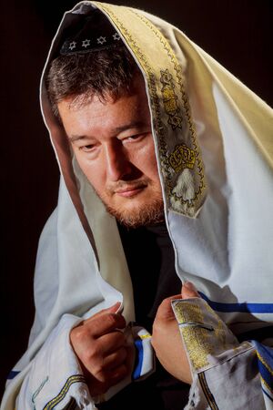 Jewish man wrapped in talit pray religious orthodox Jew with praysの写真素材