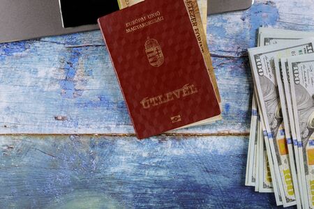 Travel from Hungarian passports and US banknotes on a computer keyboardの写真素材