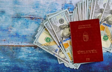 The travel citizenship Hungarian passports with money banknotes of one hundred dollars