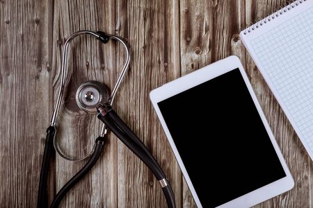 Stethoscope on a digital tablet computer medical equipment in the office of doctorsの写真素材