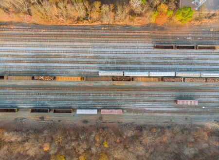 Metal recycling from drone above view on railway wagon filled with scrap metal industrial work