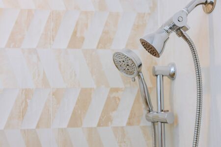Detailed of a shower head with shower spray the jets of water drops flowingの写真素材