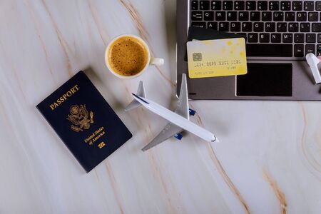 Book your flight with using a laptop for buying airline tickets on a credit card, willingness to travel with USA passportの写真素材