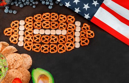 Snacks and with chips and salsa out for american super bowl watching party top viewの写真素材