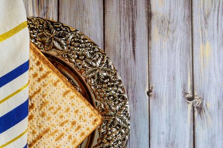 Jewish Pesah celebrating, matzoh and traditional seder plate with tallit, Passover holidayの写真素材