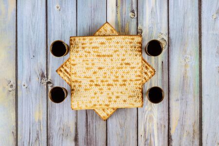 Pesah holiday celebration, matza unleavened bread and four cup kosher wine, jewish Passover holidayの写真素材