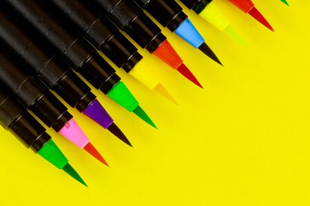 Artist watercolor calligraphy brush supplies set on desk top viewの写真素材