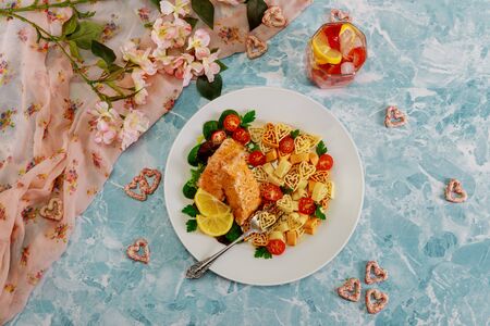 Romantic dinner heart shape pasta, salmon and vegetable.Valentines Day concept.の写真素材