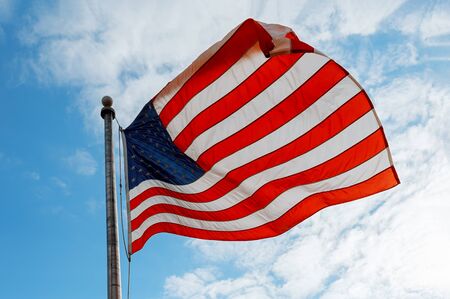 United States of America flag on the blue sky