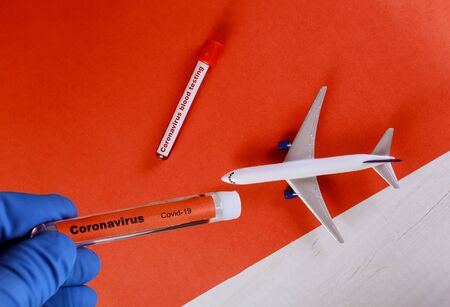 Covid-19 coronavirus, Middle East Respiratory Syndrome 2019-nCoV with test tube blood planeの写真素材