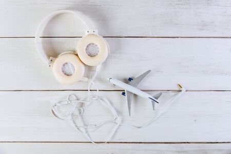 preparation for traveling concept on a model plane airplane on light backgroundの写真素材