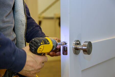 Install door knob with a screwdriver to the room.の写真素材