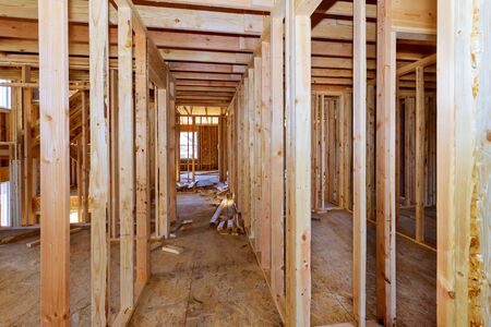 Wood framing beam on new house under construction interiorの写真素材