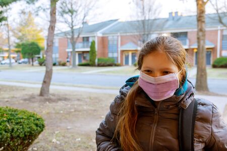 Girl school has mask protect herself from Corona virus COVID-19