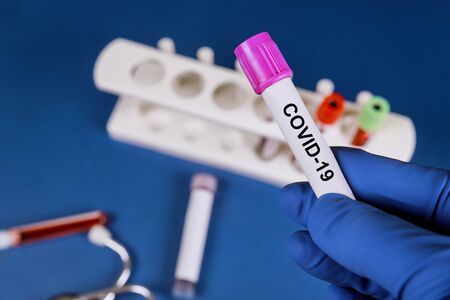Medical test-tube with Coronavirus Covid 19 infected blood sampleの写真素材