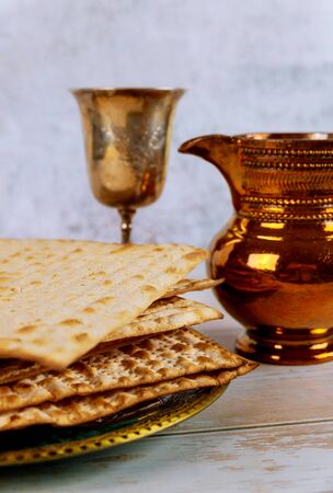 Jewish Passover holiday celebration, matza unleavened bread and cup kosher wineの写真素材