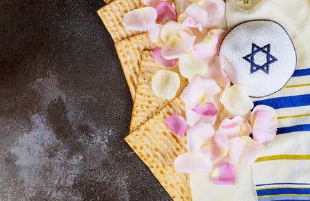 Holiday Pesah celebration, passover matza unleavened kosher bread jewish of fresh pink rose flowerの写真素材