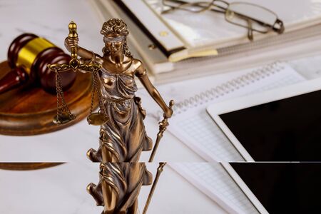 The Statue of Justice symbol, legal law office on a digital tablet of lawyers professional of Judgeの写真素材