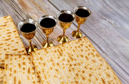 Matzoh passover jewish holiday celebration matzoh with kiddush four cup of red kosher wine