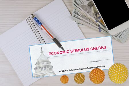 Federal monetary assistance stimulus U.S. global pandemic Covid 19 lockdown economic check US 100 dollar bills currencyの写真素材