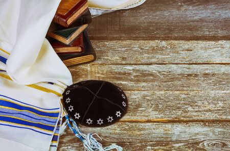 Jewish ritual with kippah and talit praying in the Jewish hebrew prayer book on a synagogueの写真素材