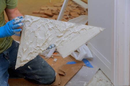 Spreading wet mortar before applying tiles on bathroom floor tile.の写真素材