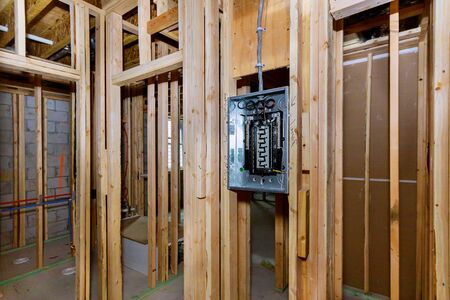 Construction home electrical power supply unfinished basement of interior wood framingの写真素材